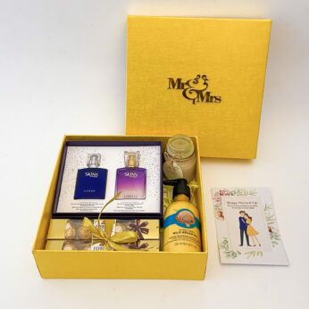 Elegant wedding gift hamper with the the bridal box that includes Couple Perfume , Chocolate and more with blissful greetings!