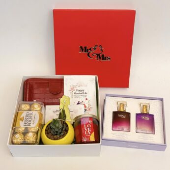 Premium wedding gift hamper with the Couple Perfume , Plant and more with blissful greetings!