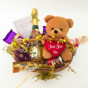 Delightful Anniversary hamper with a Teddy Bear, Wine and blissful greetings