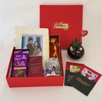 Elegant anniversary gift box for couples with a Dairy Milk , Mug and blissful greetings