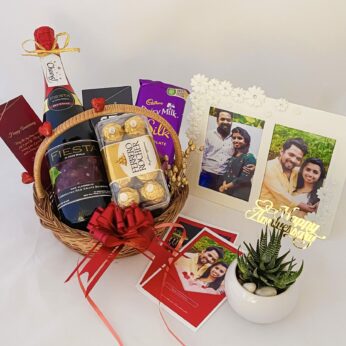 Special anniversary gift hamper with a Wine , Chocolate and blissful greetings 