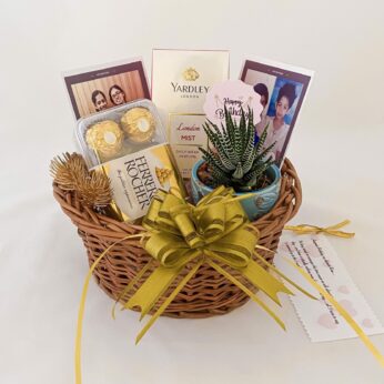 Adorable Birthday gift hamper with perfume, plant and a sweet greetings.