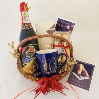 Delightful Birthday gift hamper with Tasty wine,mug and a sweet greetings.