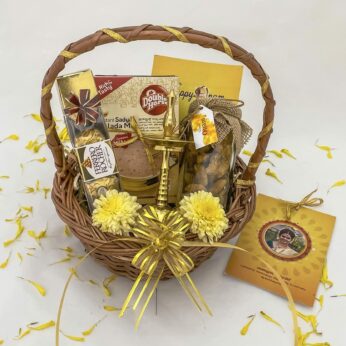 Cute onam gifts hamper basket with Nilavilakku and jaggery chips