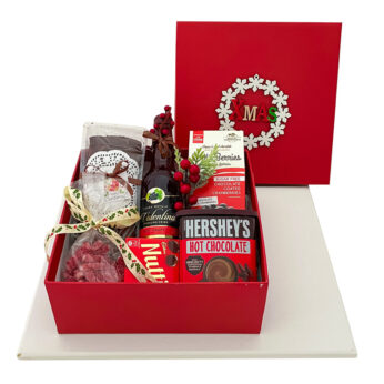 Christmas secret santa gifts hamper box (north pole style) with cakes, wine, chocolates