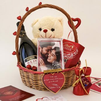 Charming valentine’s day week gift hamper with elegant Teddy, Wine, Frame, and Cards