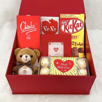 Elegant first wedding anniversary gift for wife filled with tasty chocolates and more