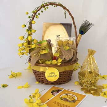 Quintessential gifts for Vishu adorned with Gold coins, jaggery chips, banana chips, and more