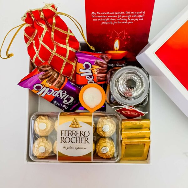 One-Of-A-Kind Colorful Diwali gifts Treats  With Chocolates, Dry Fruits, And Diya - Image 5