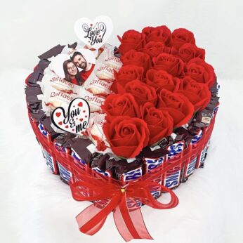 Tasteful chocolate wedding hamper for couples decorated with Artificial flowers & sweets