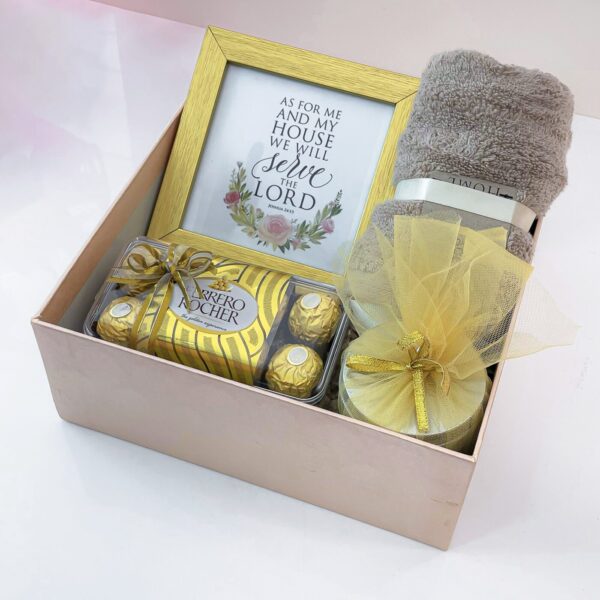 Golden Ecstasy Housewarming Gift With Chocolates, Face Towel, Scented Candle, And Photo Frame - Image 3