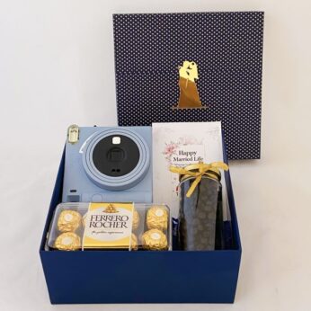 A truly luxurious gift for friend groom to be, with camera, chocolates, and more