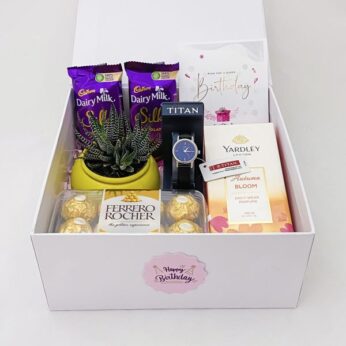 Attractive anniversary gift box for her Entails chocolates, a watch, and perfume