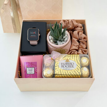 Cherished thank-you gift for women filled with smartwatch, mini plant, and chocolates