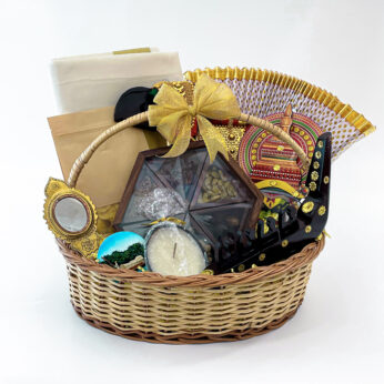 Kerala gift hamper basket for women includes Kerala saree, Aranmula Kannadi, and more