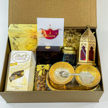 Unwrap the Festive Magic with Our Dussehra Gift Box with Sweets, Hanging lamp, Oodh cones and More