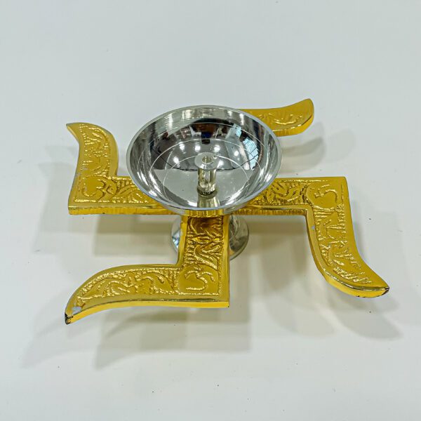 Alluring golden brass puja lamp with swastika symbol (H 1.75 x W 6 x L 1.25 inches) - Image 2