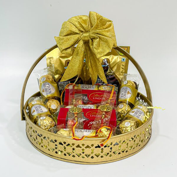 Chocolicious Bliss: Raksha Bandhan Gift Hampers with Ferrero Rocher, Hershey's Kisses, Lindt Swiss Mil, Premium Rakhis, and Greeting Card - Image 2