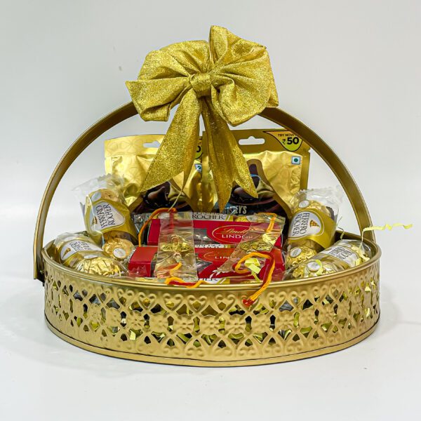 Chocolicious Bliss: Raksha Bandhan Gift Hampers with Ferrero Rocher, Hershey's Kisses, Lindt Swiss Mil, Premium Rakhis, and Greeting Card - Image 3