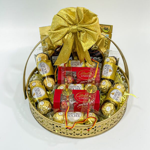 Chocolicious Bliss: Raksha Bandhan Gift Hampers with Ferrero Rocher, Hershey's Kisses, Lindt Swiss Mil, Premium Rakhis, and Greeting Card - Image 4