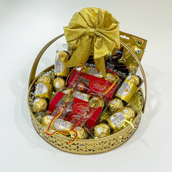 Chocolicious Bliss: Raksha Bandhan Gift Hampers with Ferrero Rocher, Hershey's Kisses, Lindt Swiss Mil, Premium Rakhis, and Greeting Card - Image 5