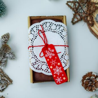 Experience Festive Joy with Our Christmas Loaf Cake, Adorned with a Red Christmas Tag ( 300 gm)