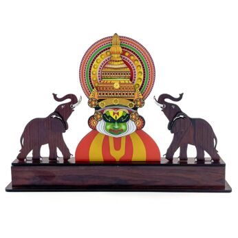 Cultural legacy engraved in a Kathakali and elephant memento (9.84 x 14.1 x 2.16 inc)