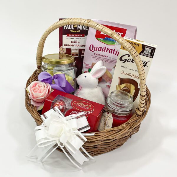 Personalized Easter Baskets embellished with a toy rabbit, scented candle, and chocolates - Image 2