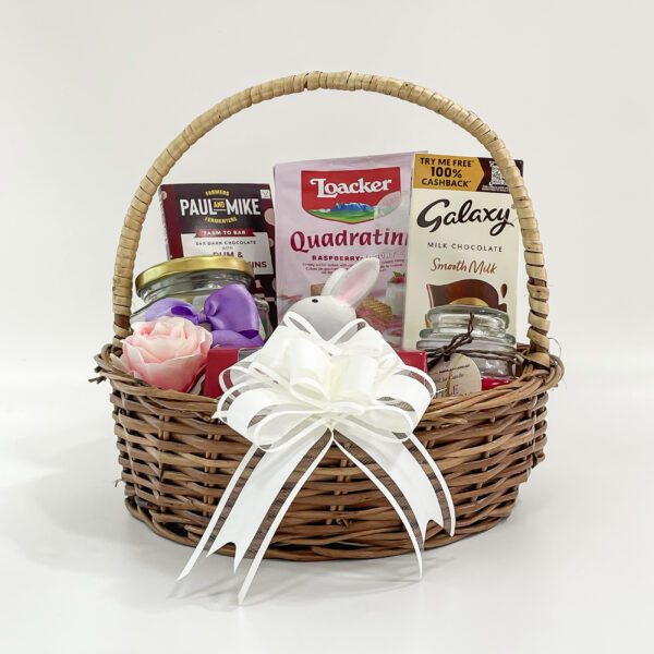 Personalized Easter Baskets embellished with a toy rabbit, scented candle, and chocolates - Image 3