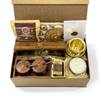 Traditional Gift for Mother’s Day filled with Kerala tissue saree, wooden Coster set, and more